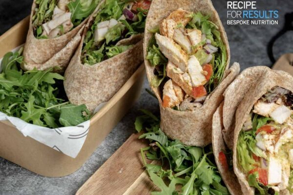 Wholesome Moroccan chicken with fresh guacamole in a wholemeal wrap. High-protein, healthy meal prep delivered fresh across Essex.